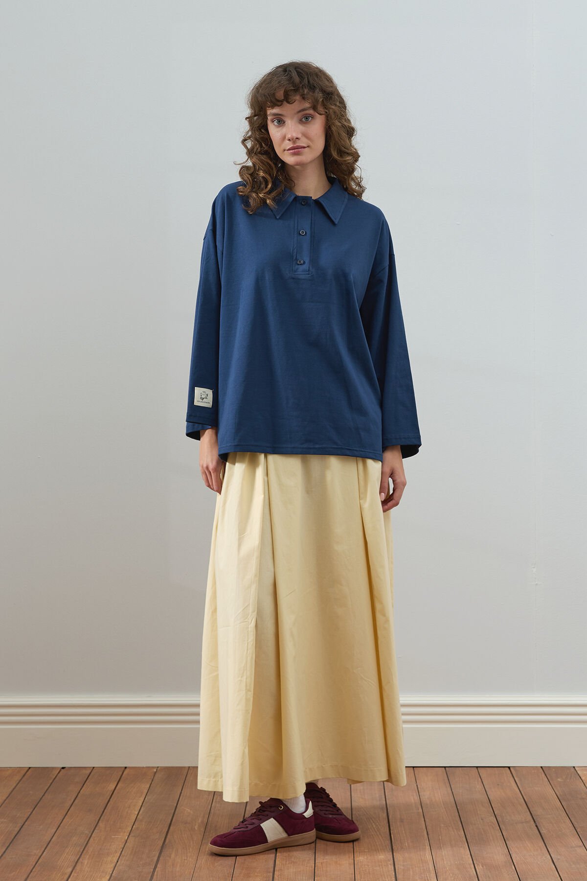 Lacivert Süprem Polo Yaka Body & Tereyağ Sarısı Pile Detay Etek Takım